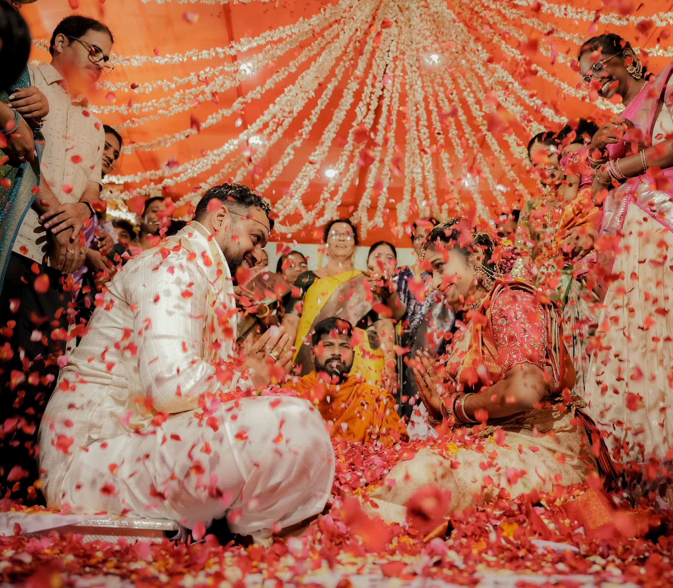Couple surrounded by petals during their ceremony