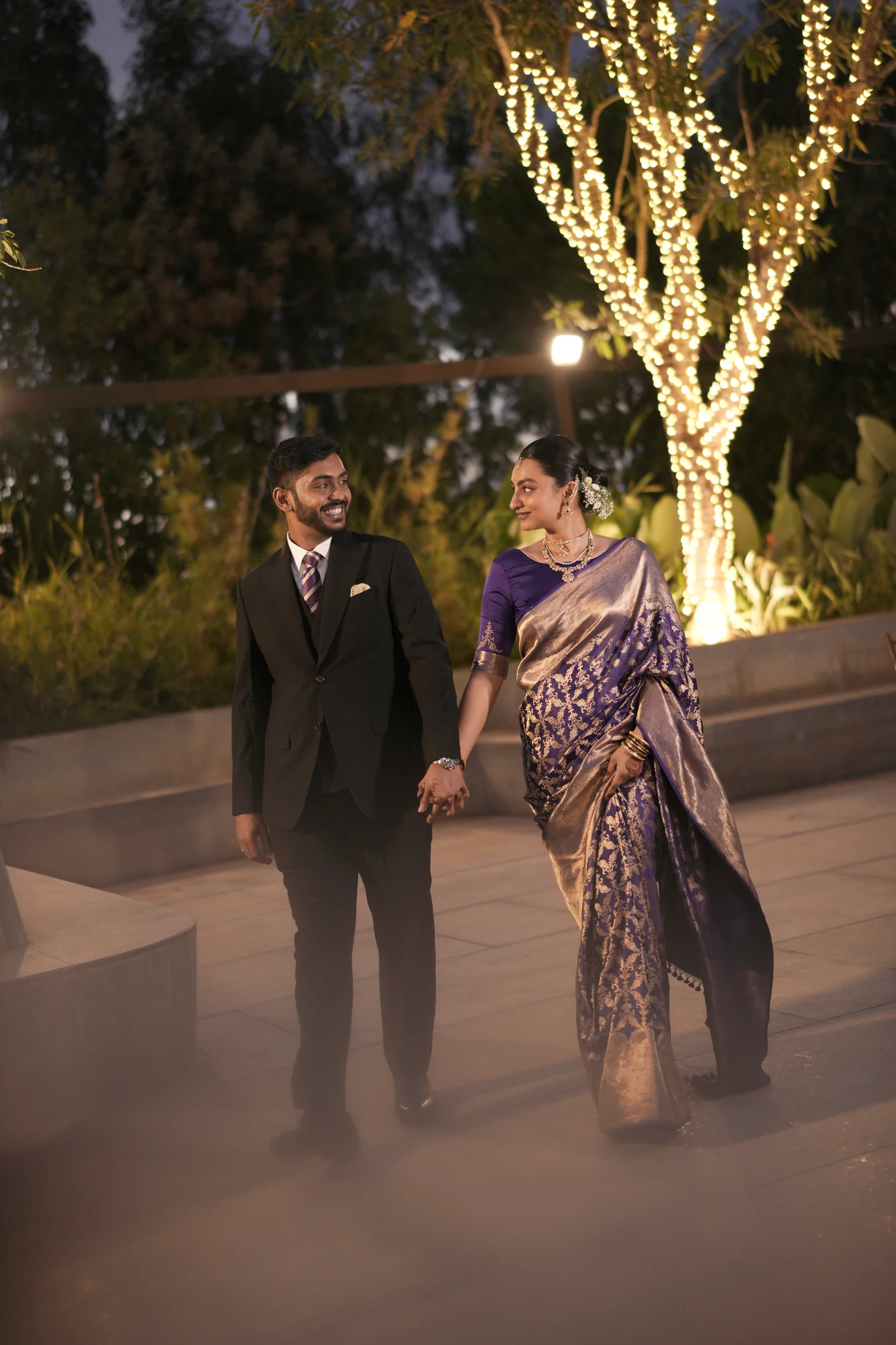 Newly married couple entering beneath sparklers