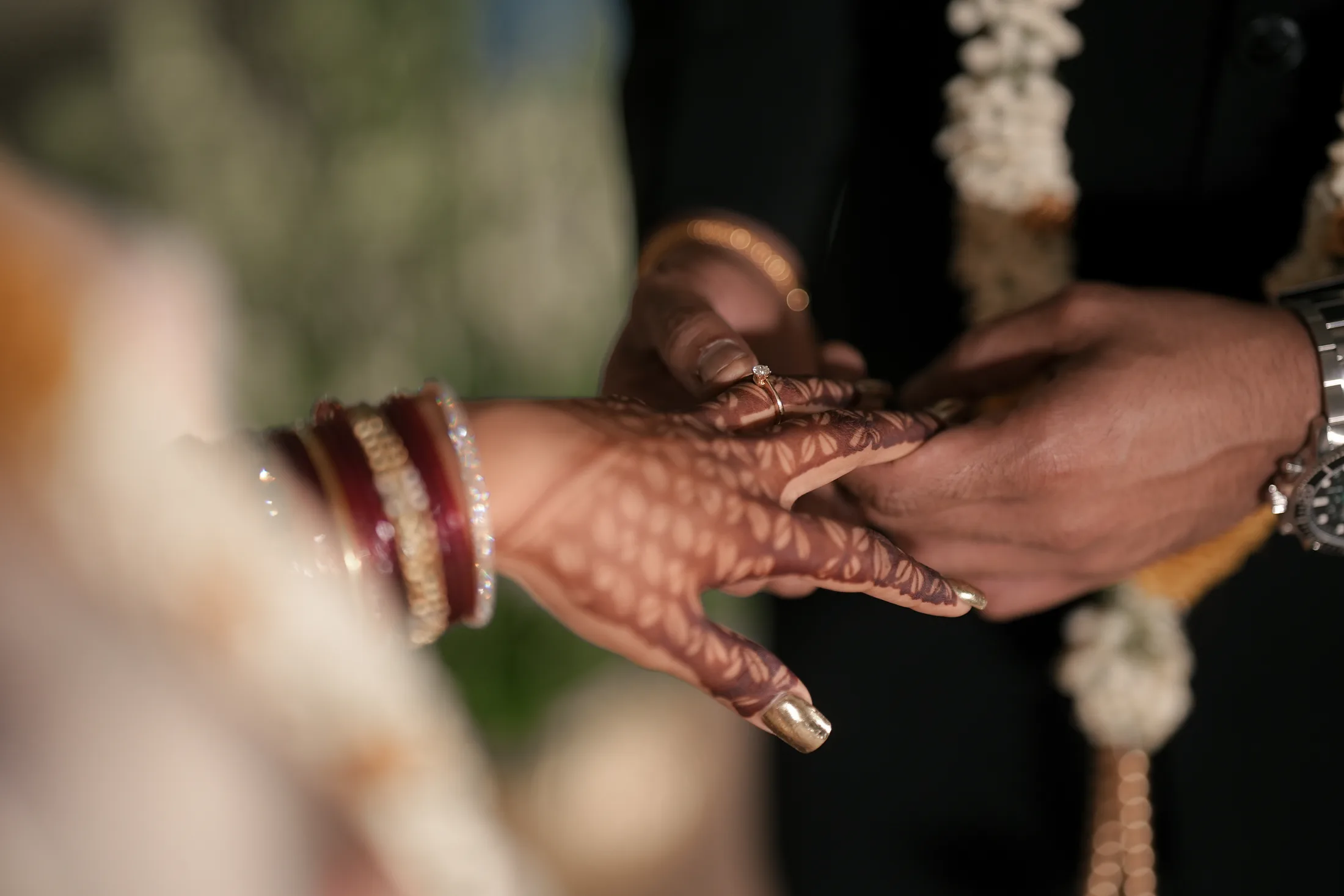 Couple's hands during the ring ceremony