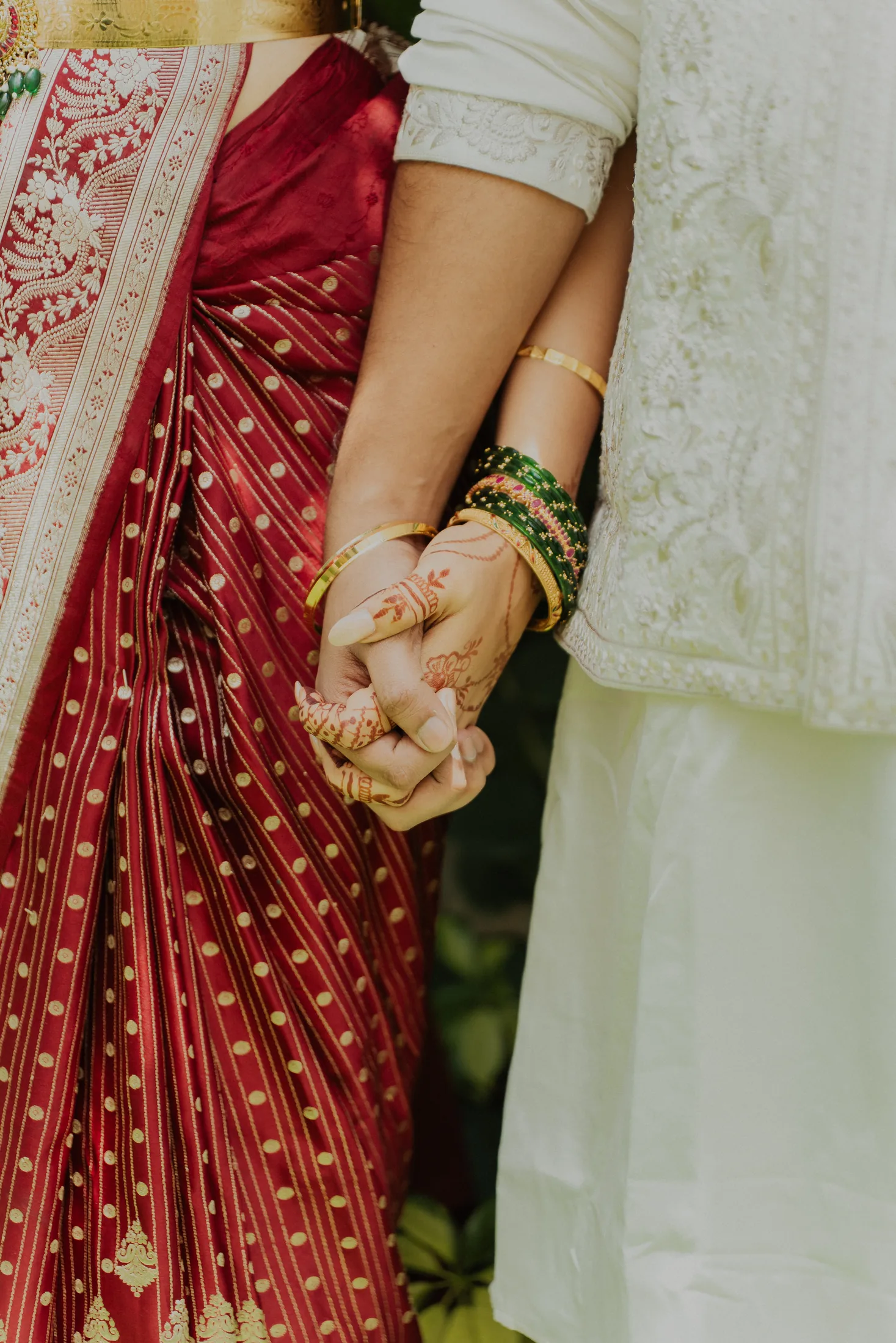 A couple holding hands before the ceremony